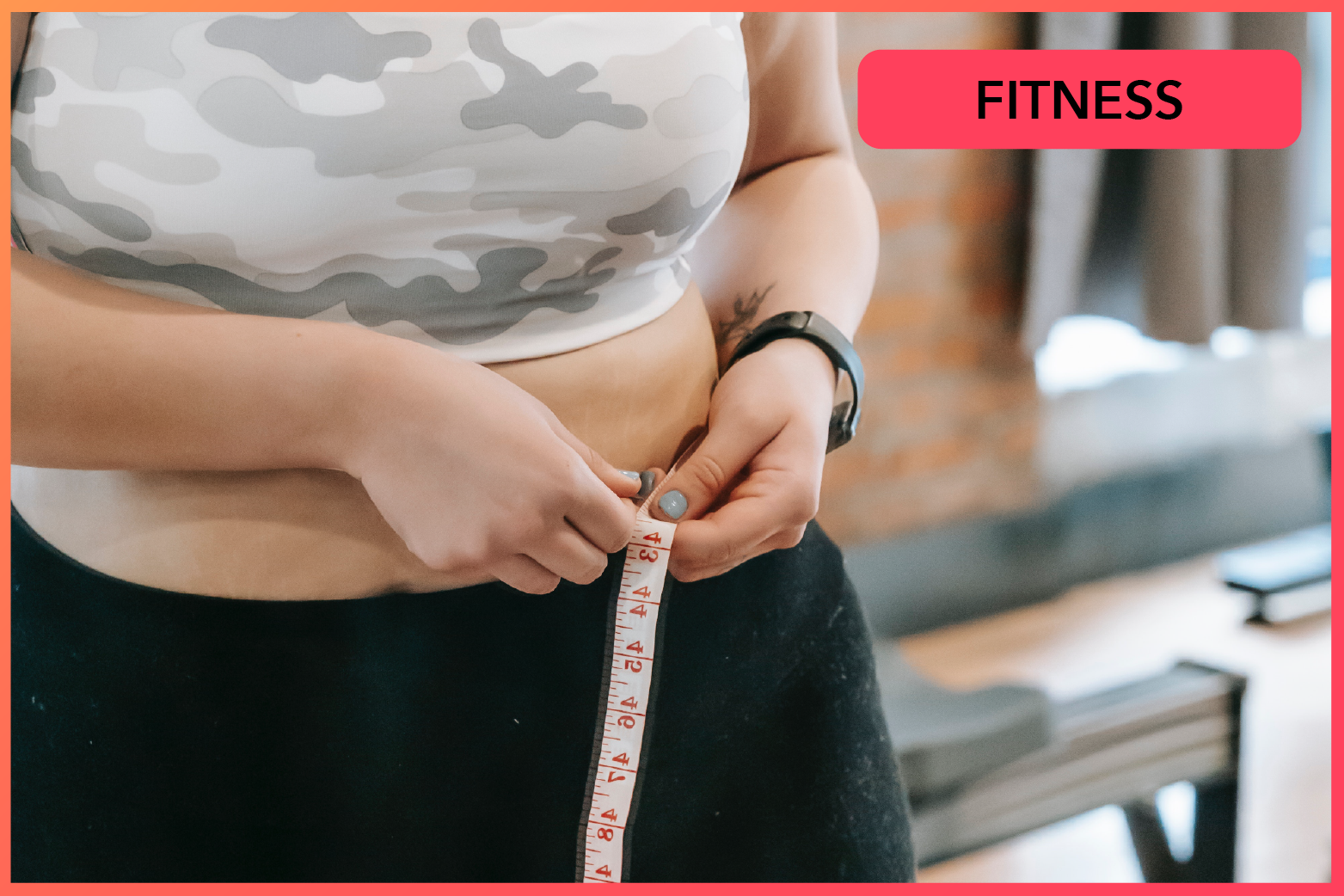 A woman measuring her belly with a tape measure